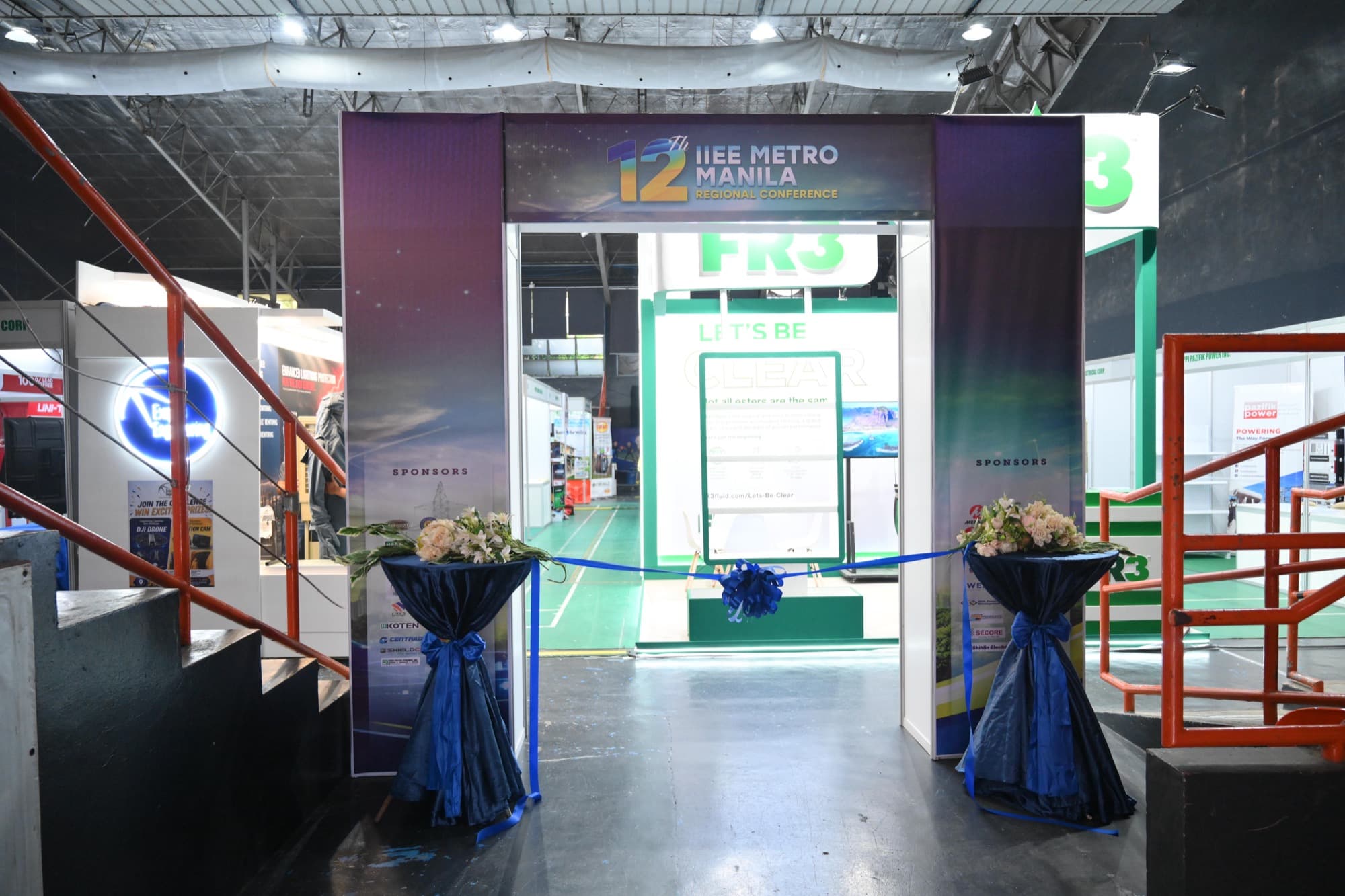Ribbon-cutting ceremony at the exhibit hall entrance